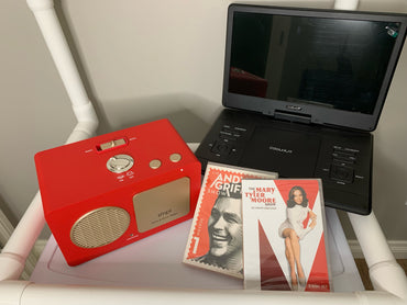 Red radio, portable DVD player, and vintage-style tv shows calming entertainment