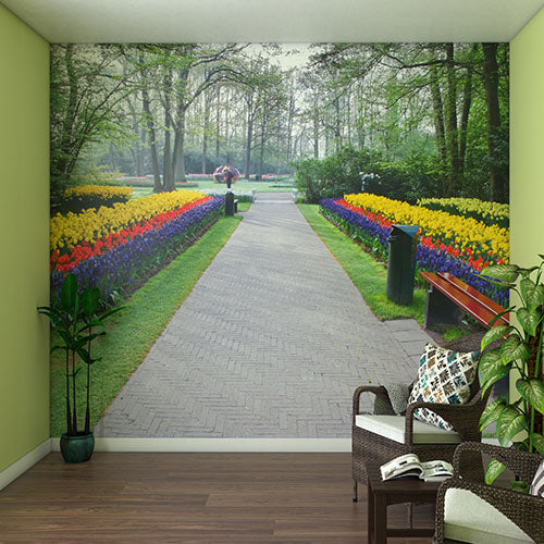 Wall Mural with a large wall mural of a garden pathway and colorful flowers.