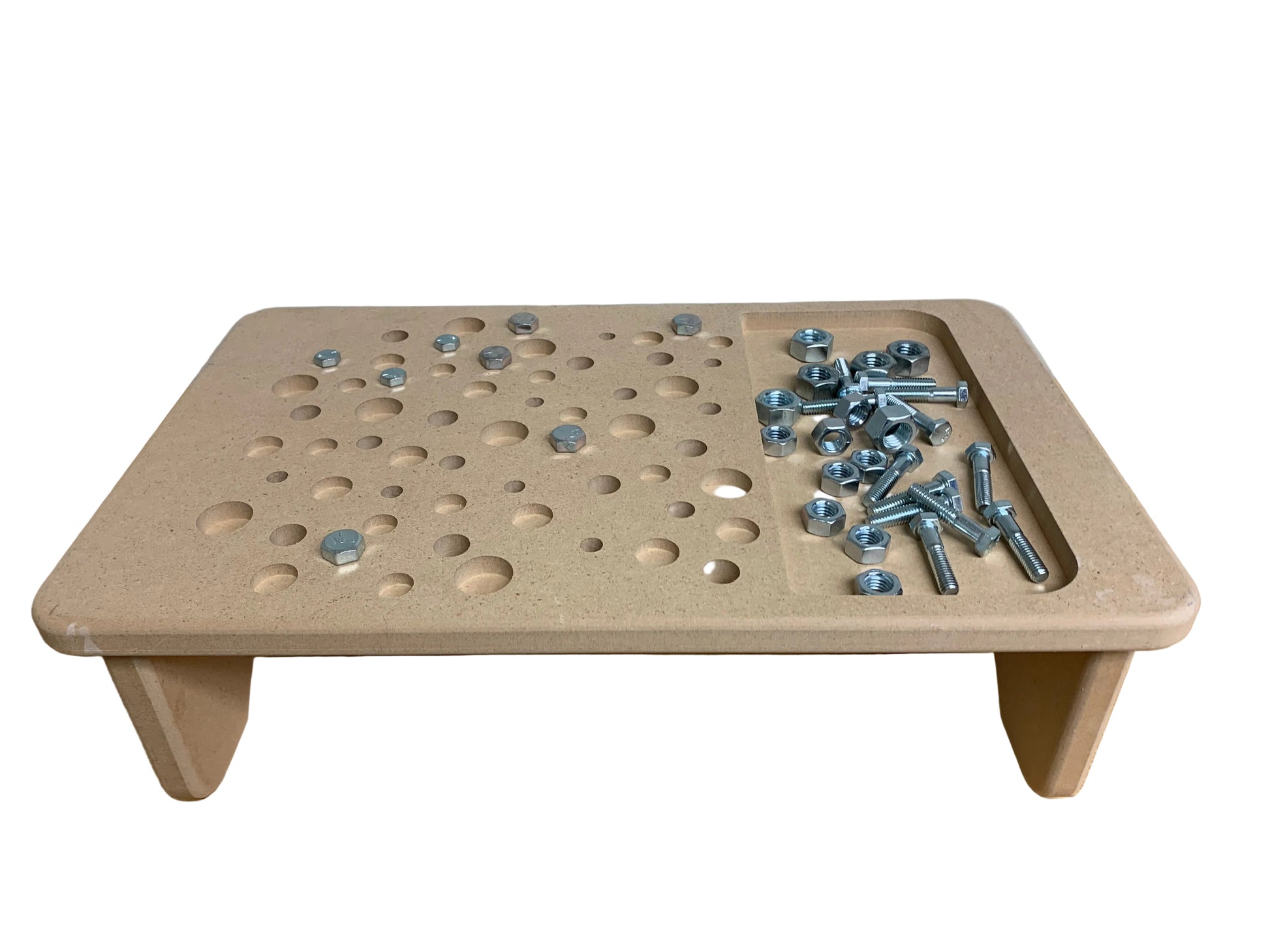 Wooden pegboard with holes and metal bolts on a wooden surface