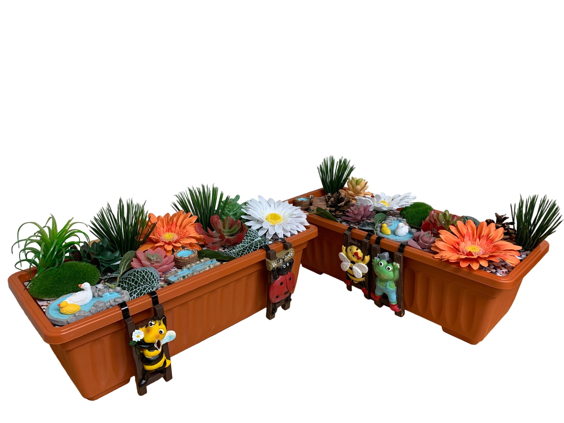 Miniature garden setup with plants and decorative elements on a wooden surface.
