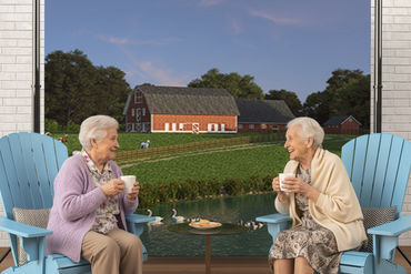 Two elderly Polish women talking with coffee in blue Adirondack chairs